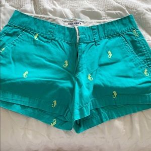 Green shorts with seahorses on them